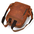 Genuine leather laptop backpack in brown with sturdy straps and multiple pockets for organization