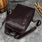 Genuine leather mens daypack in dark brown with adjustable straps and sleek design for daily use