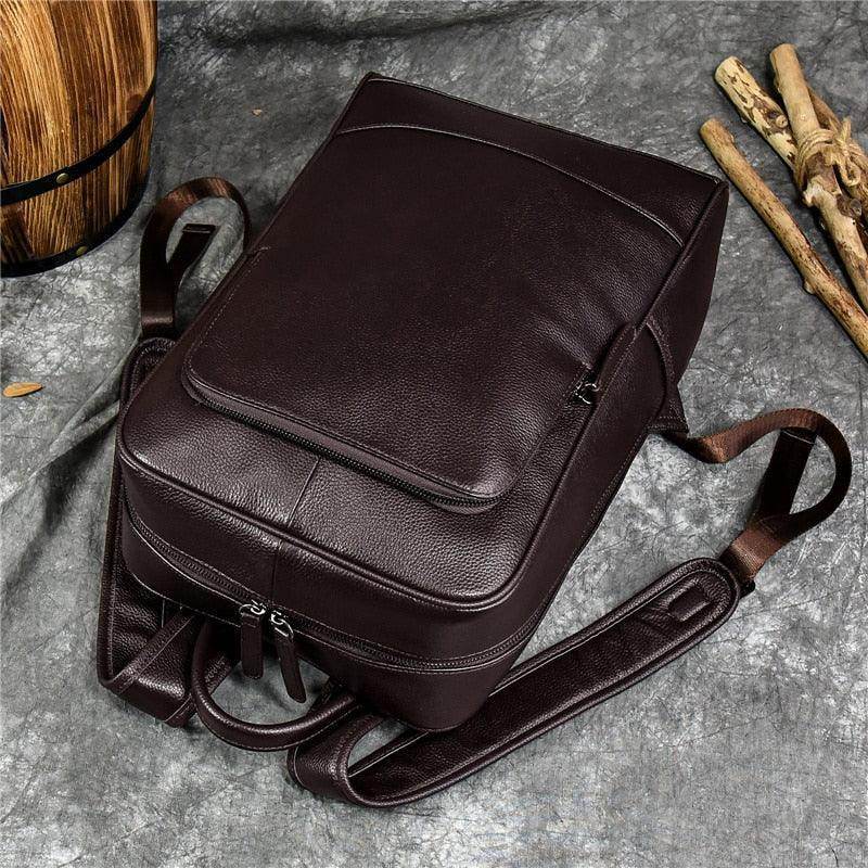 Genuine leather mens daypack in dark brown with adjustable straps and sleek design for daily use