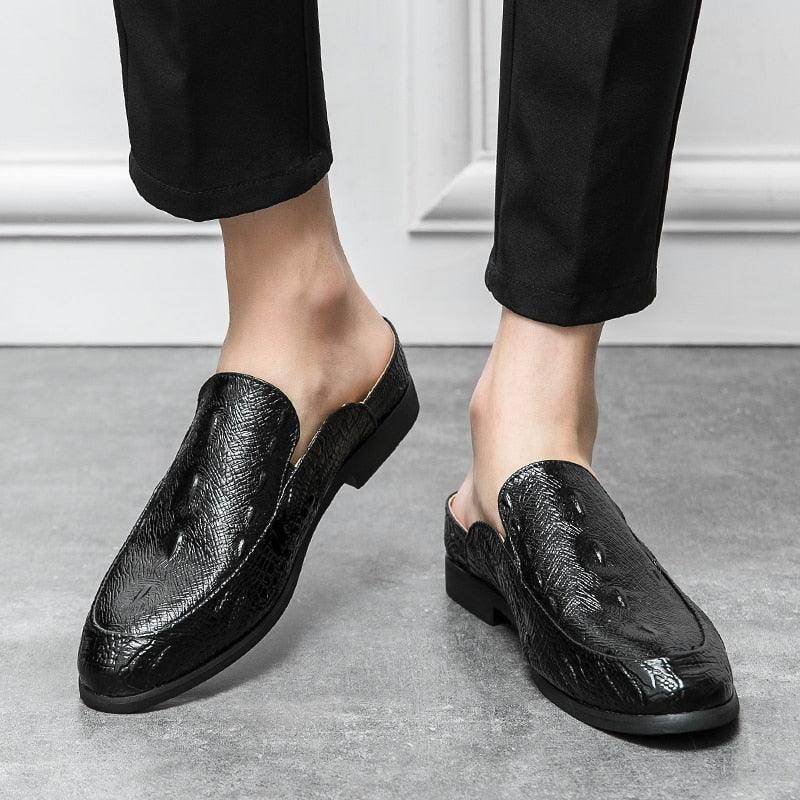 Stylish black genuine slip-on loafers with a unique design for men's formal and casual wear