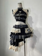 Punk vintage ruffle skirt outfit costume with black belts, lace ruffles, and plaid layers on mannequin