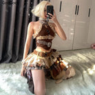 Woman wearing punk vintage ruffle skirt outfit costume with belts and plaid details taking a mirror selfie