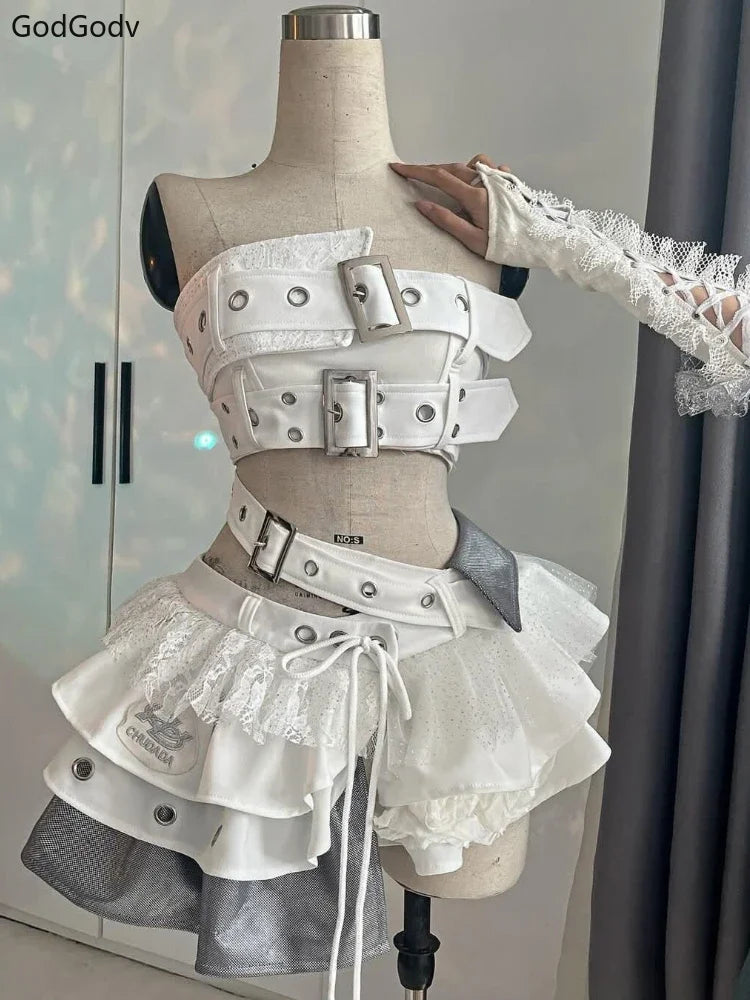 White and gray punk vintage ruffle skirt outfit costume with belts and lace details on a mannequin