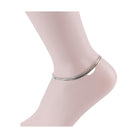 Silver anklet on a mannequin ankle showcasing minimalist design by Bella Chic