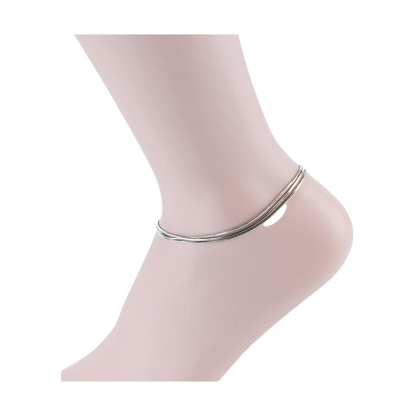 Silver anklet on a mannequin ankle showcasing minimalist design by Bella Chic
