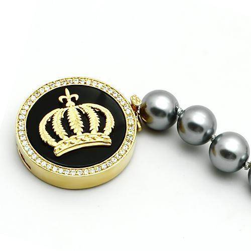 Gold brass crown bracelet with black and gray pearls, featuring a sparkling crown centerpiece