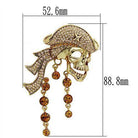 Gold skull brooch pin with sparkling crystals and hanging jewels for stylish accessory lovers