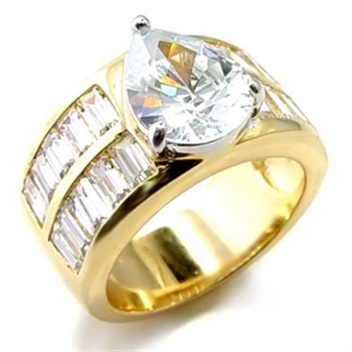 Stunning gold tone teardrop engagement ring with a large pear-shaped center stone and baguette accents