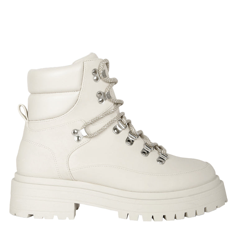 White hiking boot with chain details on a light gray background