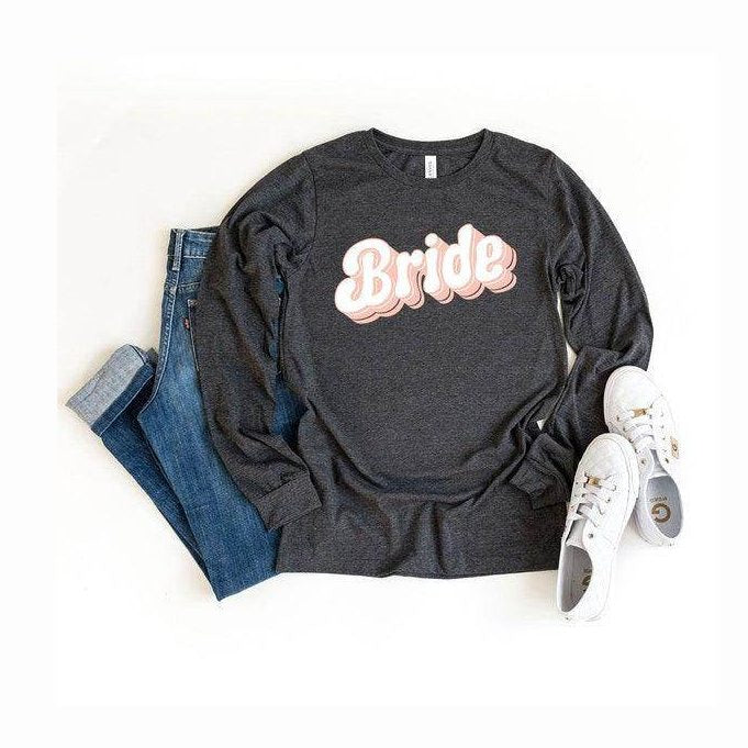 Graphic Bride Shirt Women in dark gray with stylish script design paired with jeans and white sneakers
