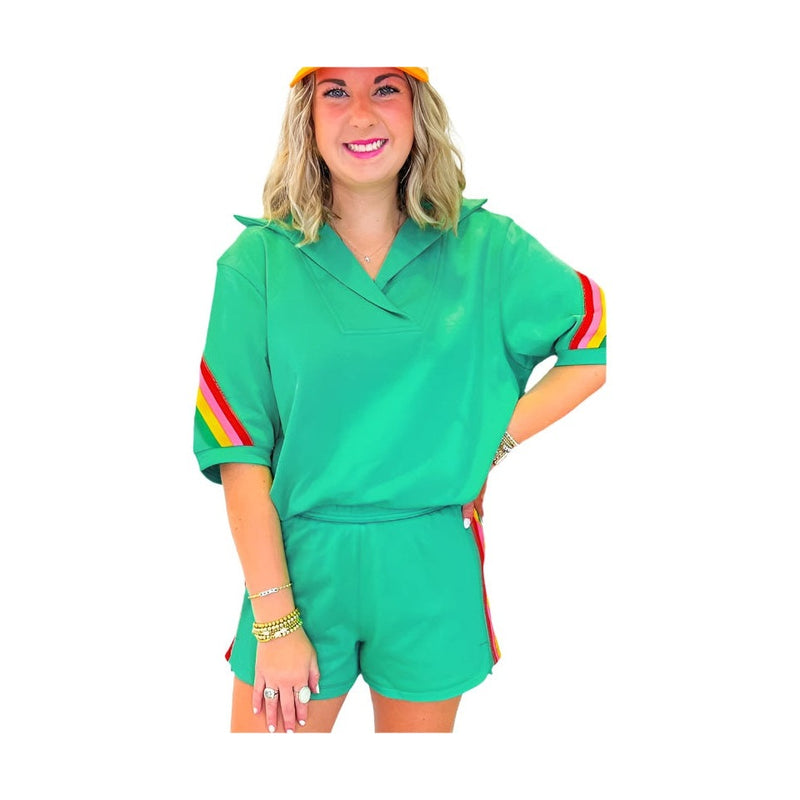 YNIQUE green colorblock lounge set with rainbow stripes on sleeves and sides worn by woman