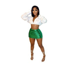 Women’s green puffer skirt by Red Iphigenia with a stylish ribbed design, paired with a white crop top