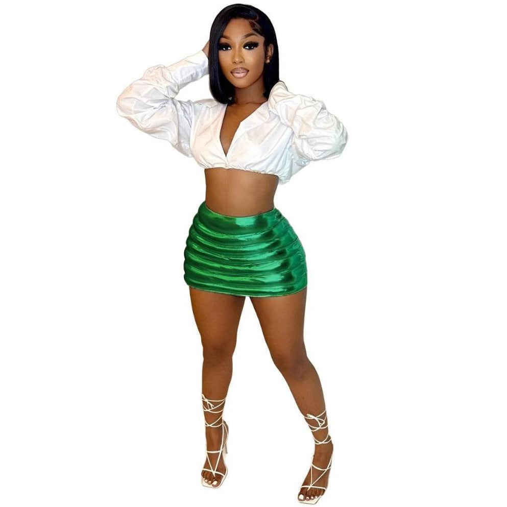 Women’s green puffer skirt by Red Iphigenia with a stylish ribbed design, paired with a white crop top