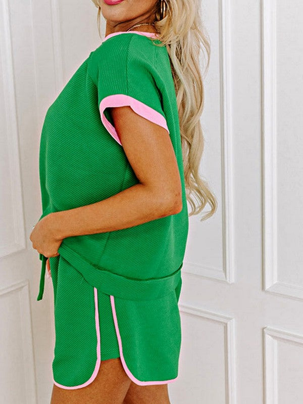 EG fashion green two tone tee and shorts set with pink trim worn by a woman