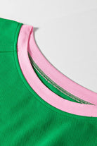 Close-up of green two tone tee and shorts set collar with pink and green ribbed fabric by EG fashion