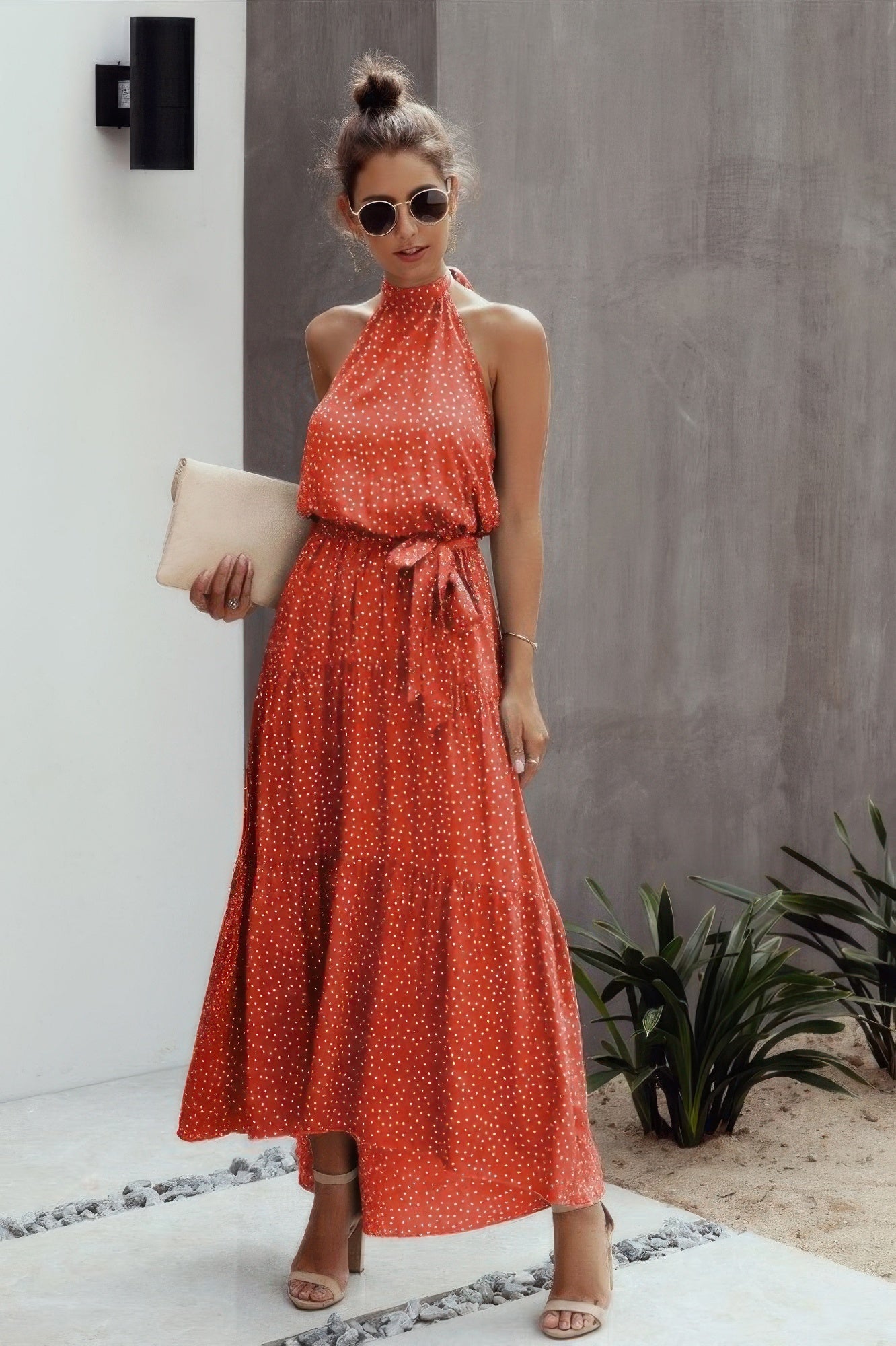 VacationGrabs halter neck polka dot dress in orange with a flowy design and tie waist detail