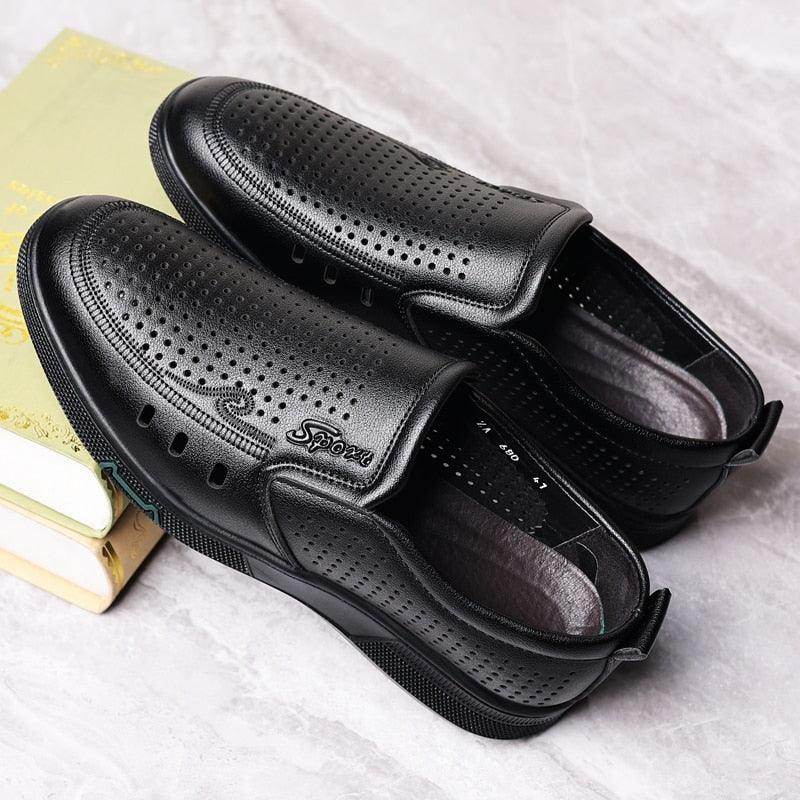 Black handmade casual slide on shoes with perforated design for breathable comfort