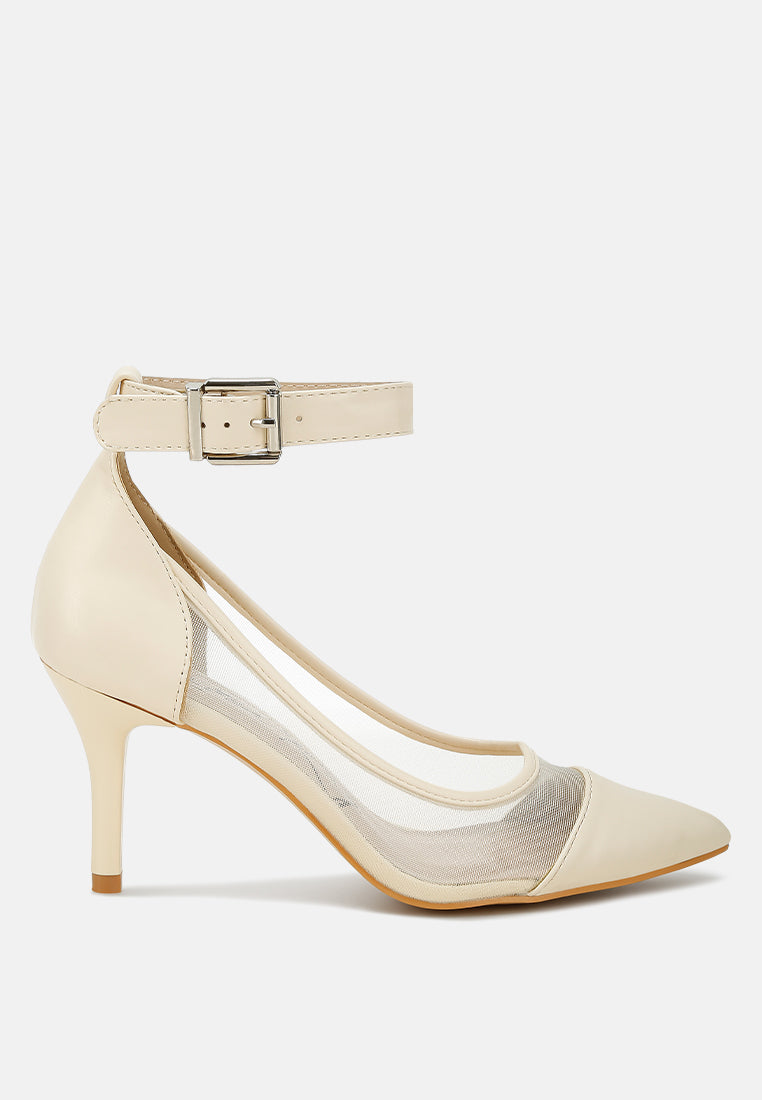 Beige high-heeled shoe with a strap on a white background