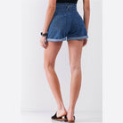 Back view of Tasha Apparel high waisted mom shorts in denim with cuffed hems