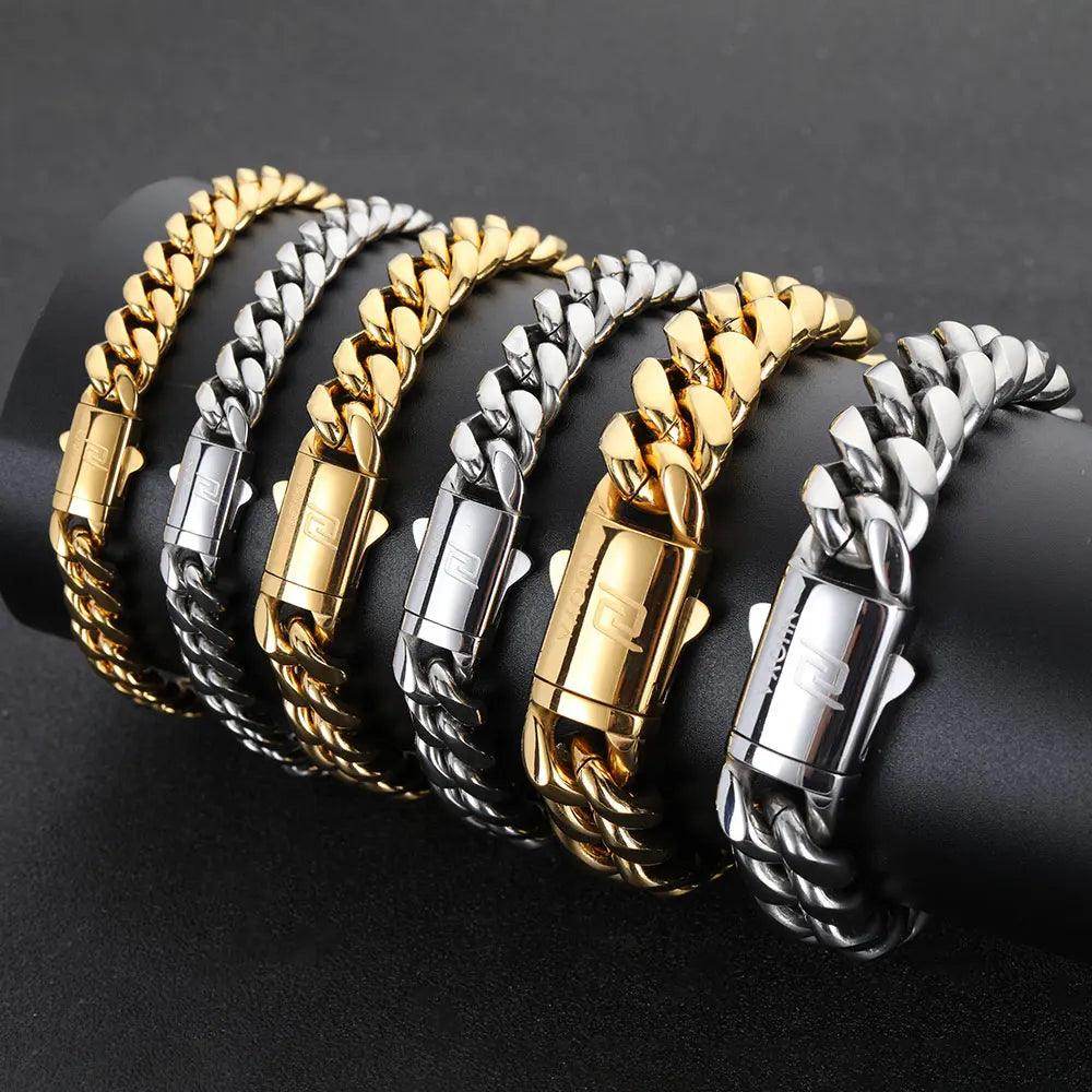 Collection of hip hop stainless steel bracelet for men in gold and silver finishes on a display stand
