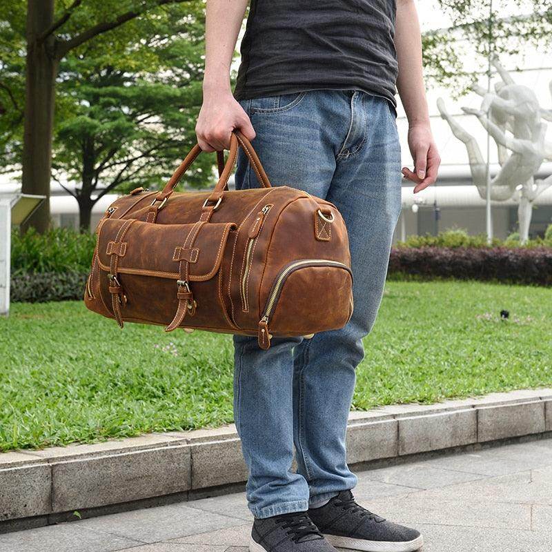 Man holding a stylish hot leather carry-on bag perfect for travel and weekend getaways