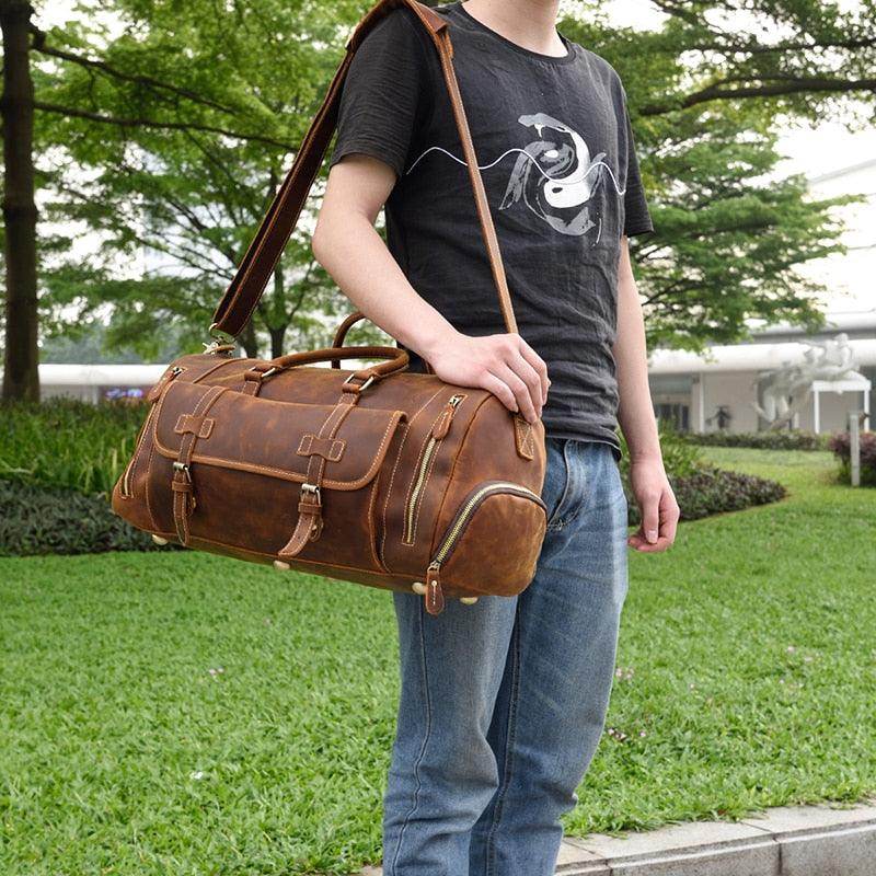 Man holding a stylish hot leather carry-on bag for travel and everyday use