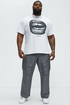 VacationGrabs trendy graphic tee for men white shirt with black lips print and gray cargo pants