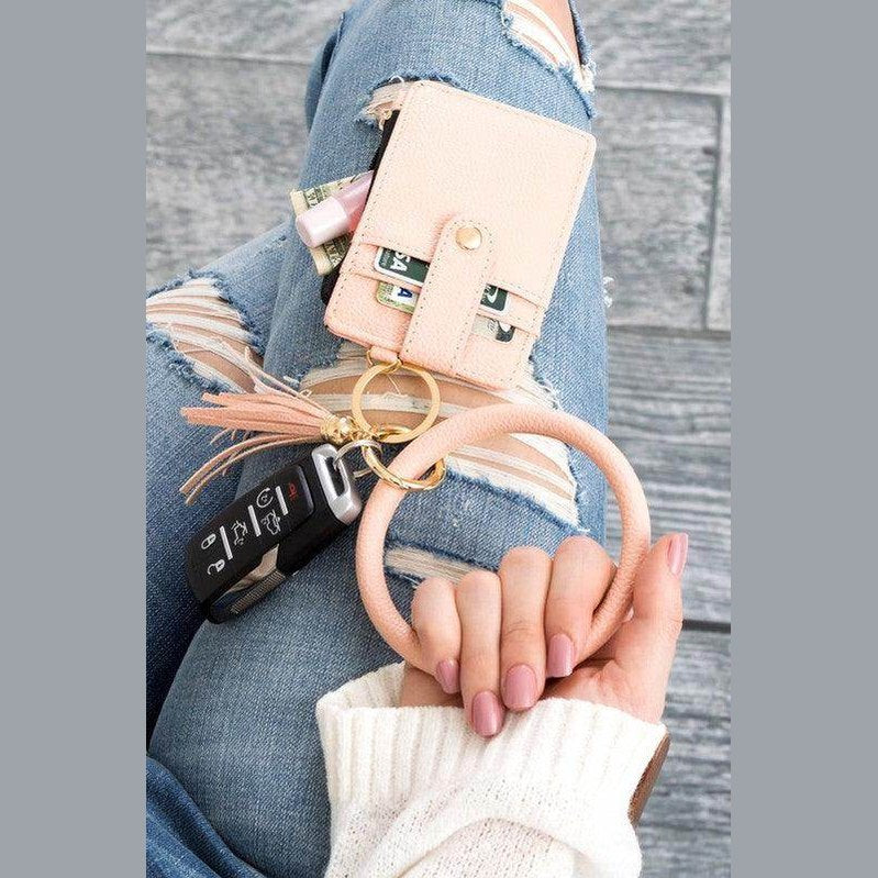 Aili's Corner ID holder keychain bracelet in pink with credit cards and keys attached for convenient access
