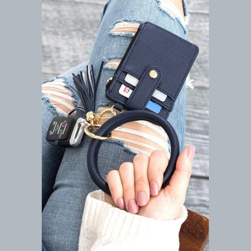 Aili's Corner ID holder keychain bracelet in navy blue with card slots and a tassel detail