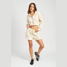 Emory Park Ivory cargo shorts for women styled with a matching cropped jacket for a trendy look