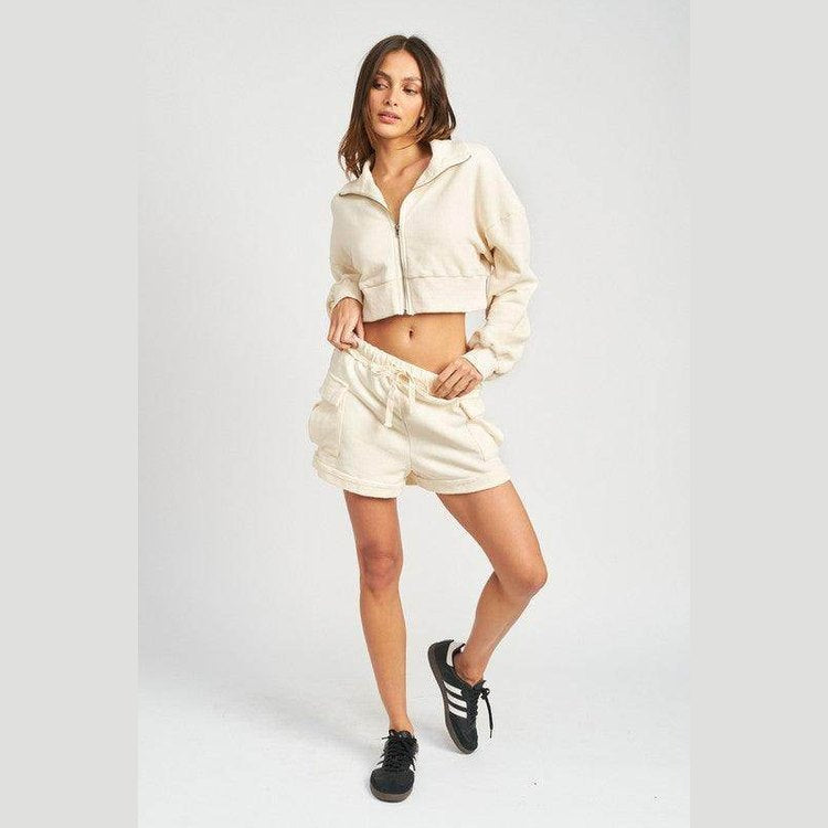 Emory Park Ivory cargo shorts for women styled with a matching cropped jacket for a trendy look