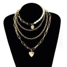 ClaudiaG Collection jester necklace for women featuring layered gold chains and pearl accents
