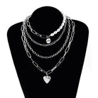 Stylish jester necklace for women featuring layers of pearls and silver chains