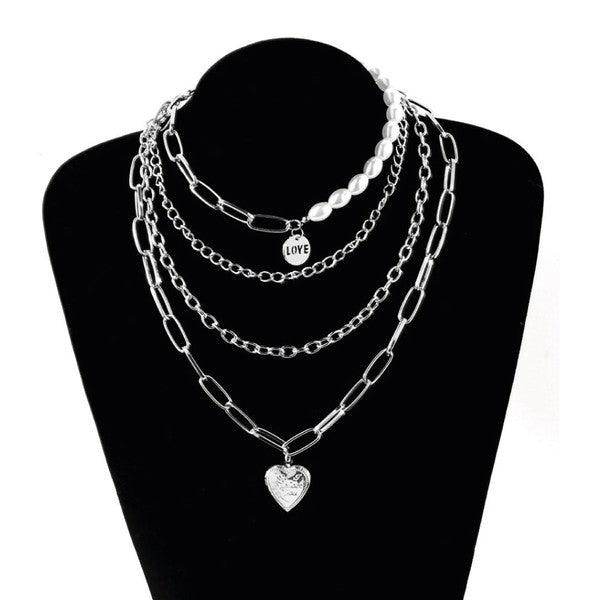 Stylish jester necklace for women featuring layers of pearls and silver chains