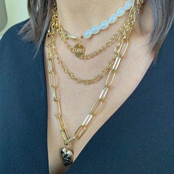 Layered jester necklace for women featuring gold chains and a heart pendant from ClaudiaG Collection