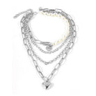 ClaudiaG Collection jester necklace for women featuring multiple silver chains and a heart pendant