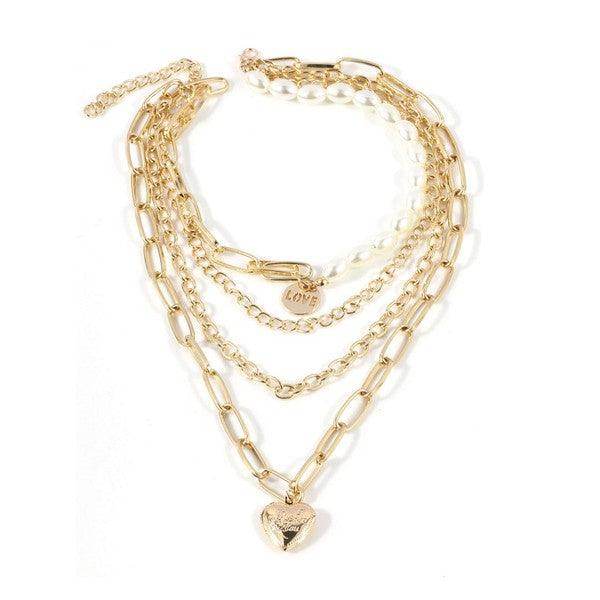 Elegant ClaudiaG jester necklace for women featuring layered gold chains and a heart charm