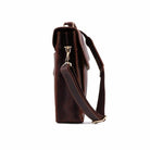 Side view of vintage leather mens briefcase with adjustable strap and durable design for professional use