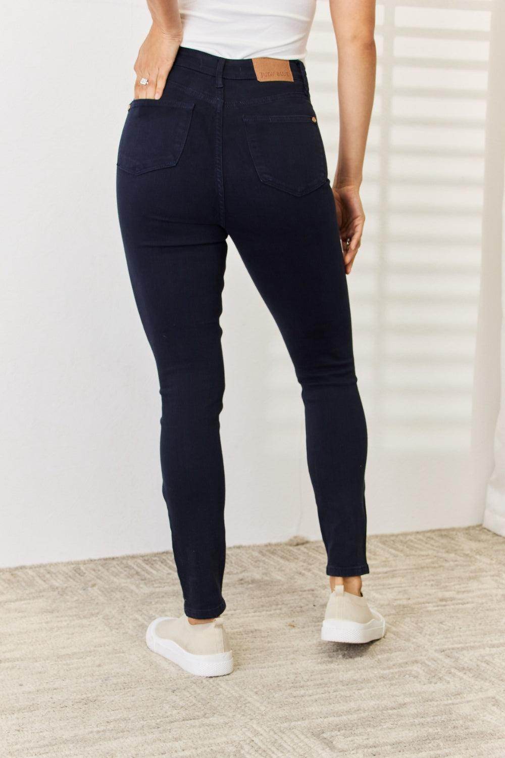 Back view of Judy Blue tummy control skinny jeans in dark wash with stylish pocket design