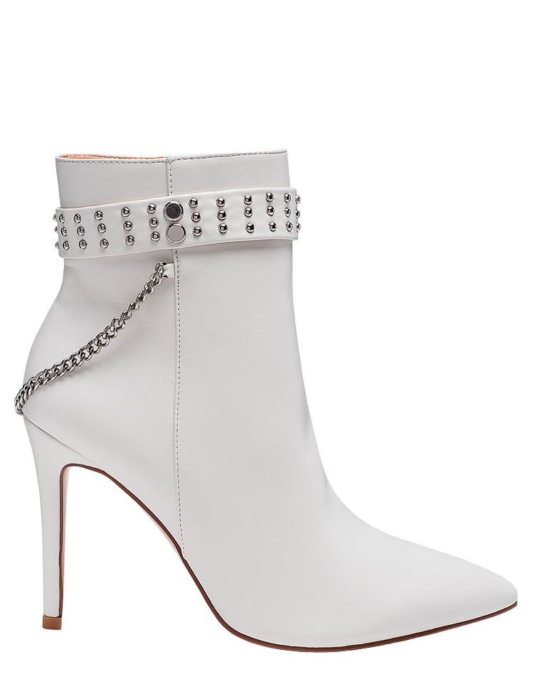 White stiletto heel boot with embellishments on a white background