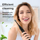Woman smiling holding black electric toothbrush, best electric toothbrush for travel with whitening benefits