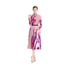 By Claude knee-length dress for travel with a vibrant floral pattern and pleated style