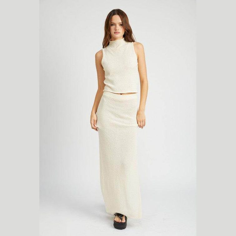 Emory Park knit sleeveless blouse in light cream paired with a matching long skirt for a stylish summer look