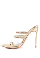 Gold metallic strappy stiletto heeled sandals with clear and chain detail straps