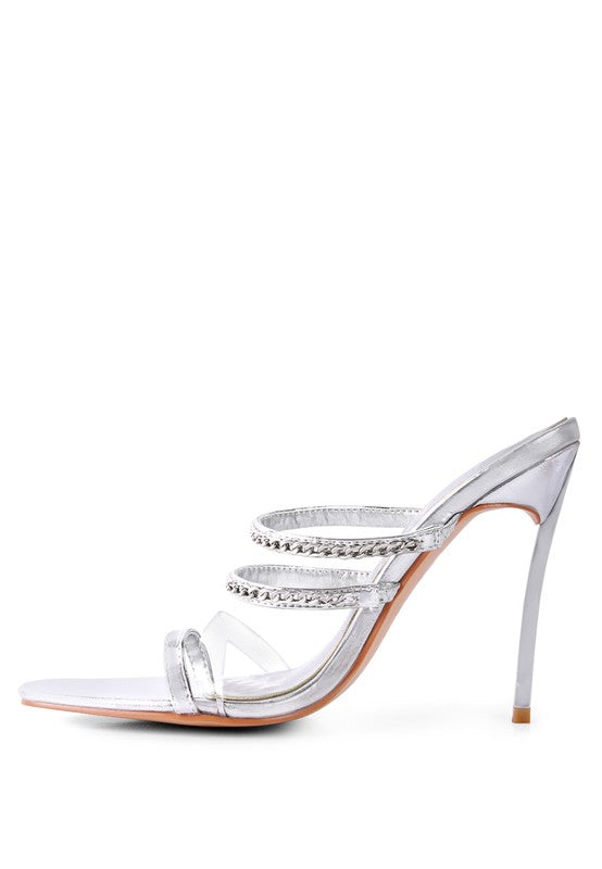 Silver strappy stiletto heeled sandals with rhinestone accents and high slender heel by Rag Company