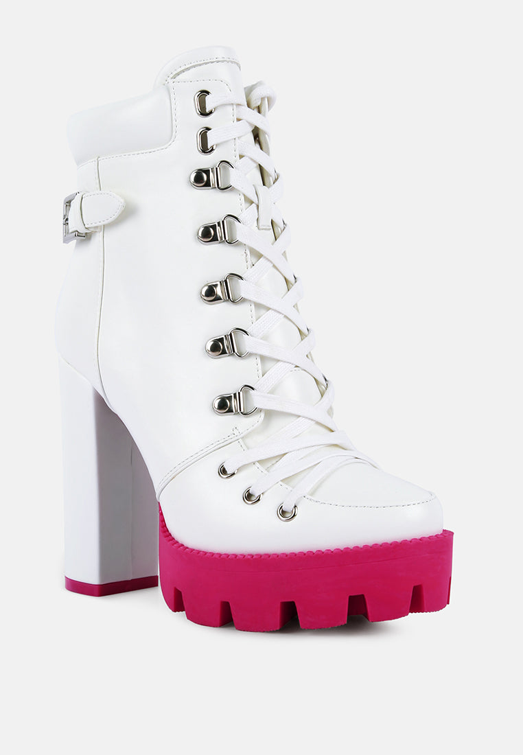 White platform boots with pink soles on a white background