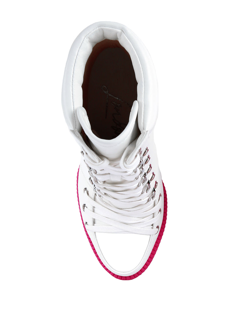 White high-top sneaker with red sole on a white background