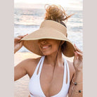 Aili's Corner large brim bow beach hat in natural color, perfect for sunny days at the shore