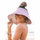 Aili's Corner large brim bow beach hat in pastel pink, perfect for sunny days by the ocean
