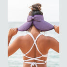 Stylish large brim bow beach hat in purple, perfect for sun protection and summer fashion